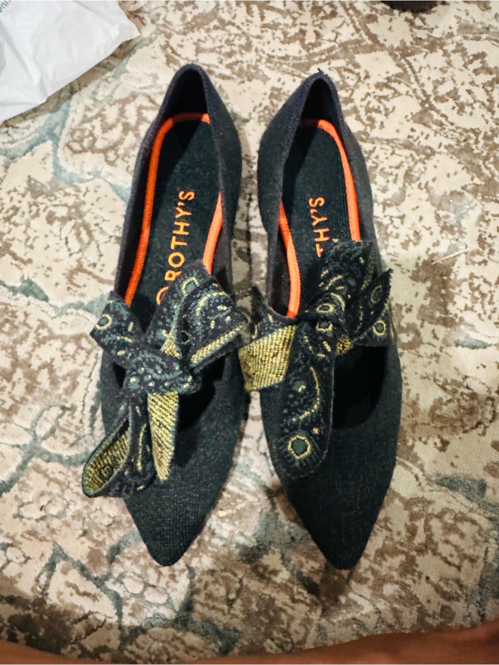 Rothy's Black Pointed Mary Jane Flats with Gold Bow Accents